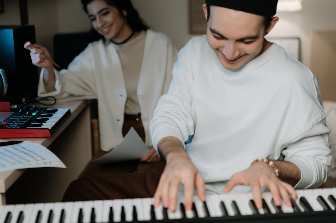 A Man in White Long Sleeve Shirt Playing the Piano